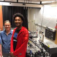 Assistant Dean George McBane in a lab with two students